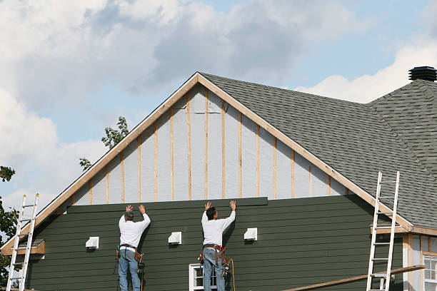 Professional Emergency Siding Repair technician working in Hampton, IL